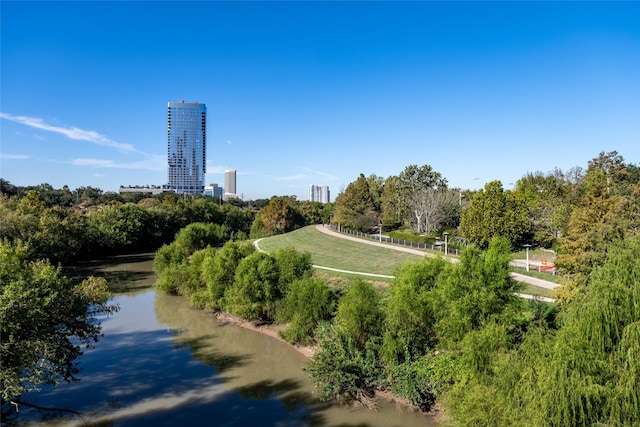 view of property's community featuring a water view and a city view