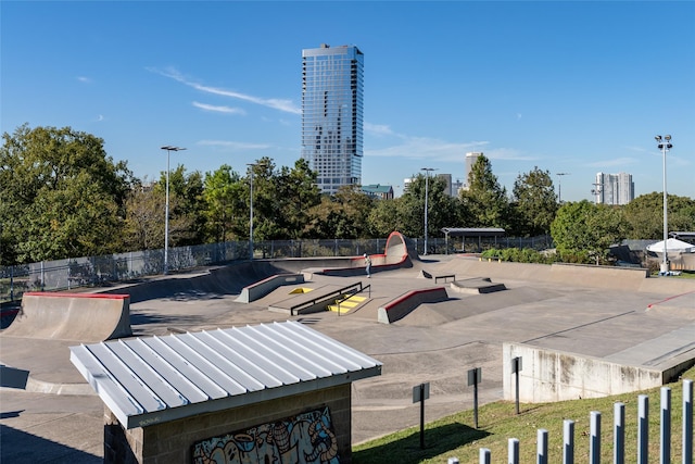 view of home's community with a view of city and fence