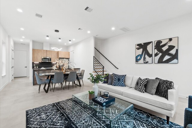 1016 Patton St, Houston, TX 77009 - living area featuring recessed lighting, visible vents, and stairs