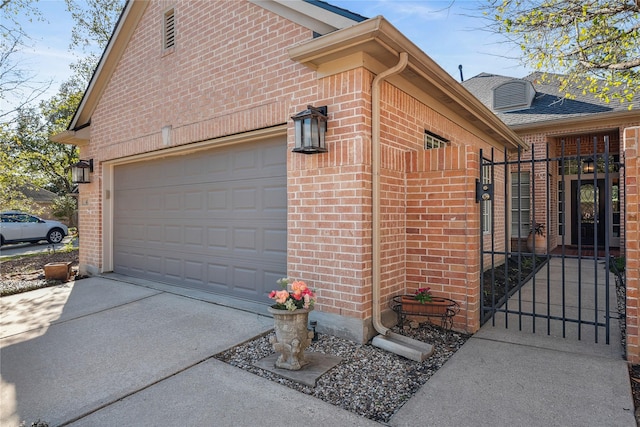 view of side of home with a garage, concrete driveway, brick siding, and roof with shingles