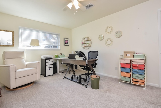 carpeted office featuring ceiling fan, visible vents, and baseboards