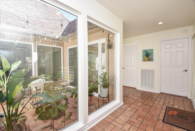 sunroom featuring visible vents