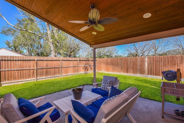 view of patio with ceiling fan, an outdoor living space, and a fenced backyard