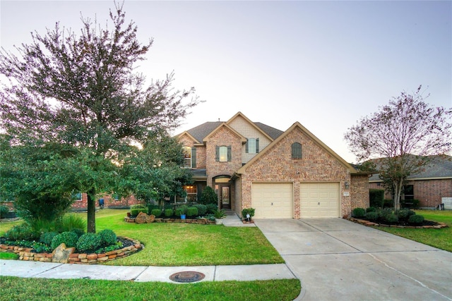 traditional-style home with concrete driveway, brick siding, an attached garage, and a front lawn