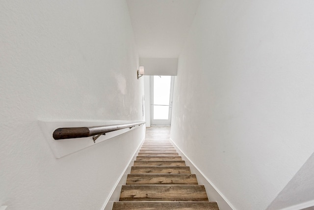 stairs with wood finished floors