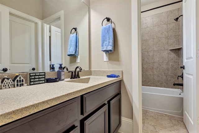 bathroom featuring  shower combination and vanity