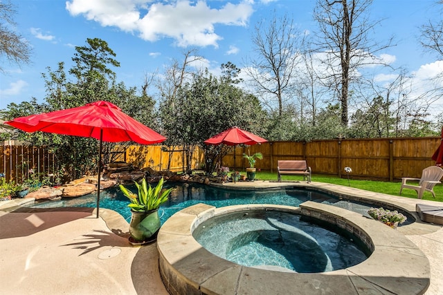 view of pool with a fenced in pool, an in ground hot tub, a fenced backyard, and a patio