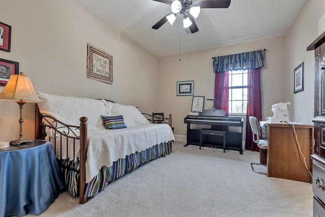 carpeted bedroom with baseboards and a ceiling fan