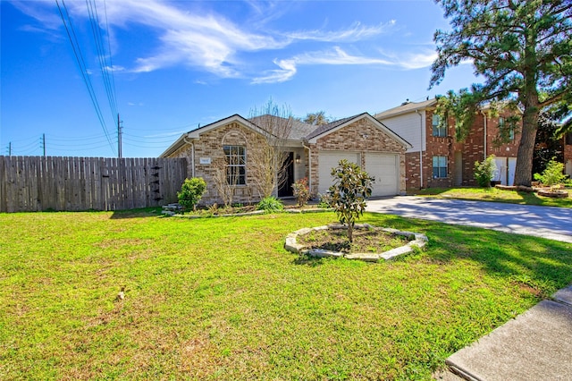 view of front of property with driveway, a front lawn, an attached garage, and fence