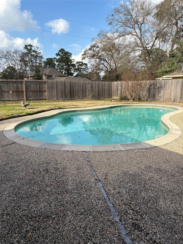 view of pool with a fenced backyard and a fenced in pool