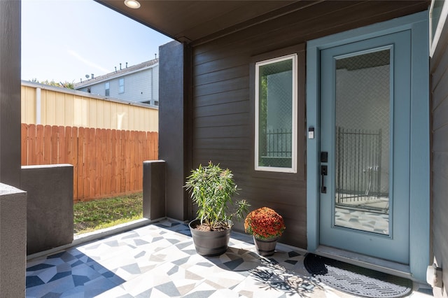 property entrance with fence