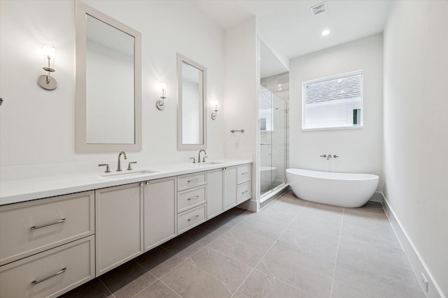 full bathroom featuring double vanity, a sink, visible vents, and a shower stall