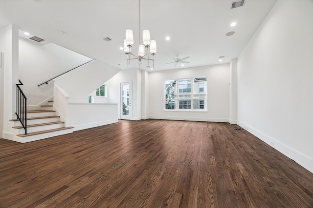 unfurnished living room with stairs, wood finished floors, visible vents, and baseboards