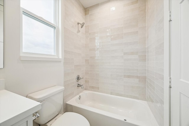 full bath with shower / bathtub combination, vanity, and toilet