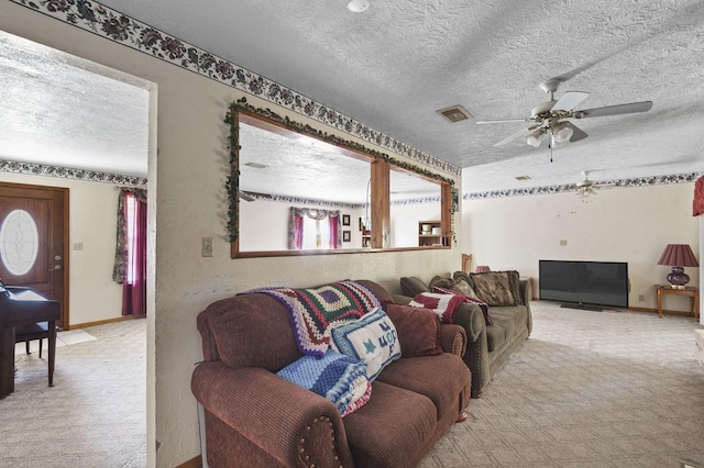 carpeted living room featuring visible vents and a textured ceiling