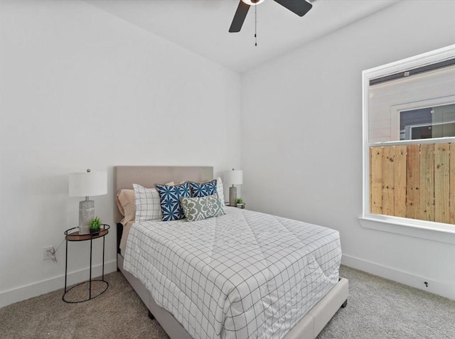 bedroom with carpet floors, ceiling fan, and baseboards