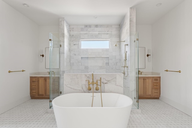 bathroom with a freestanding tub, baseboards, a shower stall, and vanity