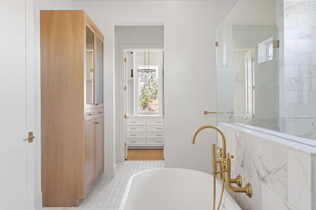 bathroom with a soaking tub and walk in shower