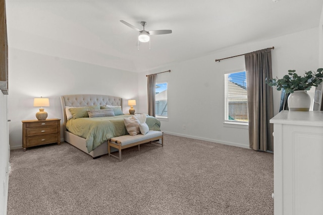 carpeted bedroom with baseboards and a ceiling fan