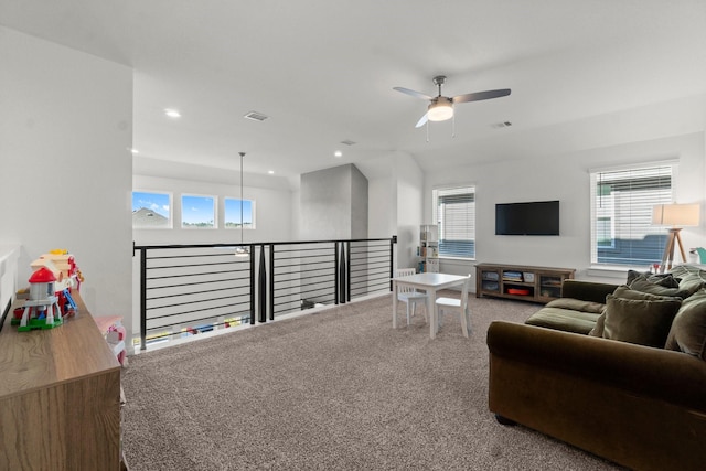 living room featuring carpet floors, visible vents, a wealth of natural light, and recessed lighting