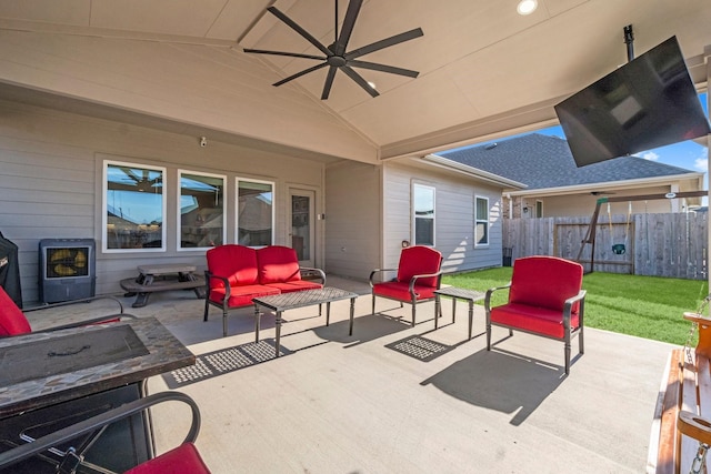 view of patio / terrace featuring outdoor lounge area, fence, and a ceiling fan