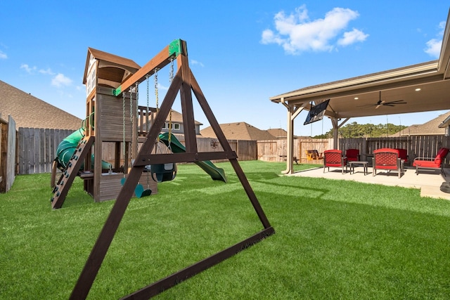 view of play area with a patio area, a fenced backyard, ceiling fan, and a lawn