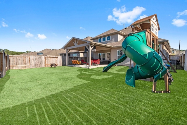 view of jungle gym with a yard, a patio area, and a fenced backyard