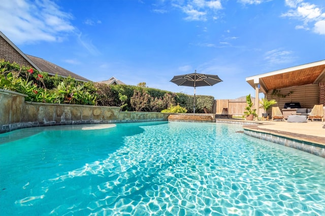 view of swimming pool with a patio, fence, a fenced in pool, and a ceiling fan