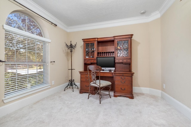 home office featuring ornamental molding, light colored carpet, a textured ceiling, and baseboards