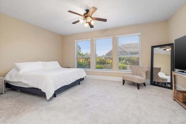 bedroom with carpet floors, baseboards, and a ceiling fan