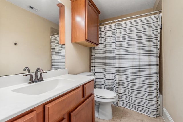 bathroom with curtained shower, visible vents, toilet, vanity, and tile patterned flooring