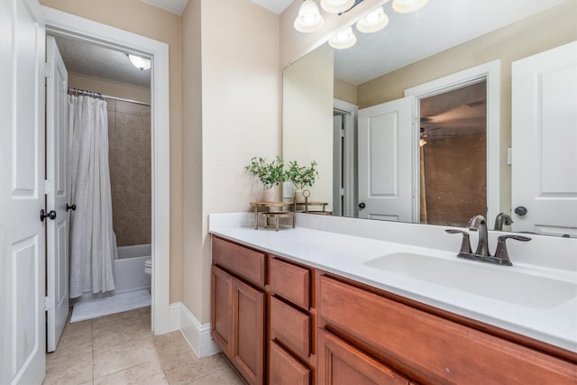 full bathroom with tile patterned flooring, shower / bath combination with curtain, vanity, and baseboards