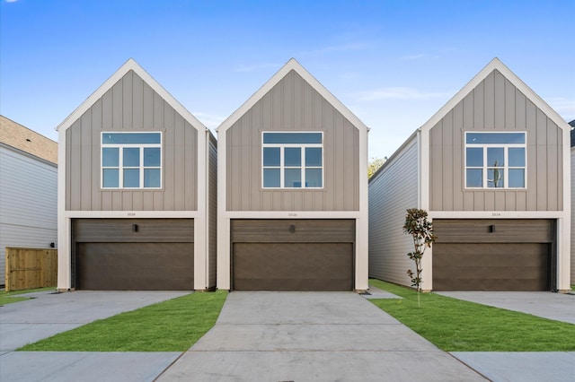 view of front of house featuring an attached garage, driveway, and board and batten siding