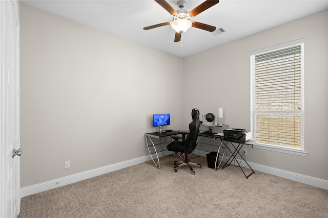 home office featuring a ceiling fan, baseboards, visible vents, and carpet flooring