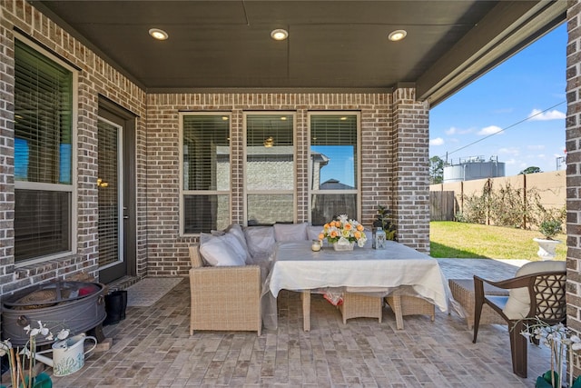 view of patio featuring fence and an outdoor living space