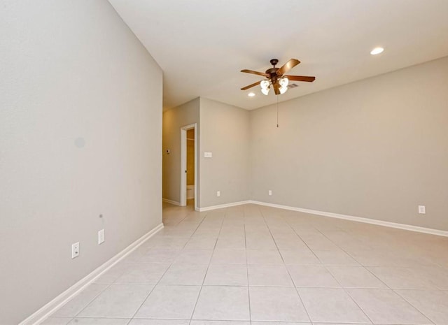 empty room featuring light tile patterned floors, baseboards, a ceiling fan, and recessed lighting