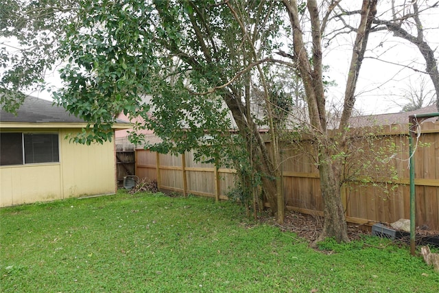 view of yard with a fenced backyard