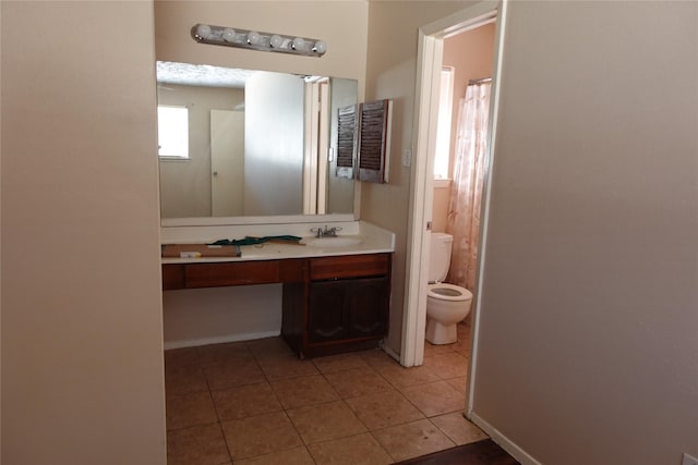 full bathroom with tile patterned flooring, toilet, and vanity