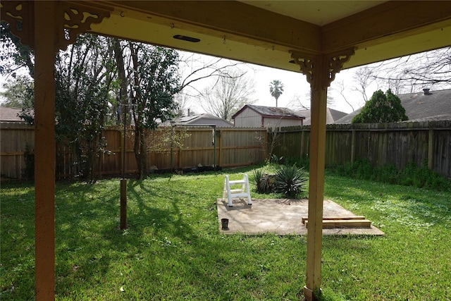 view of yard with a fenced backyard and a patio