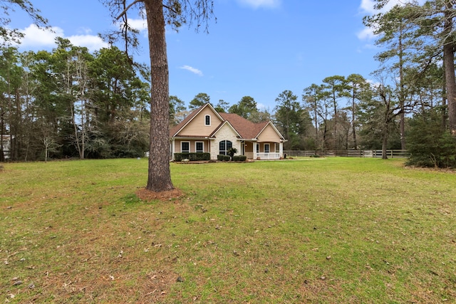 view of front of house featuring a front yard and fence