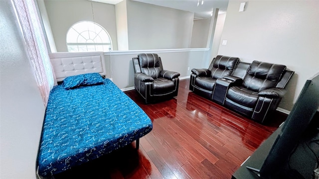 interior space with hardwood / wood-style floors and baseboards