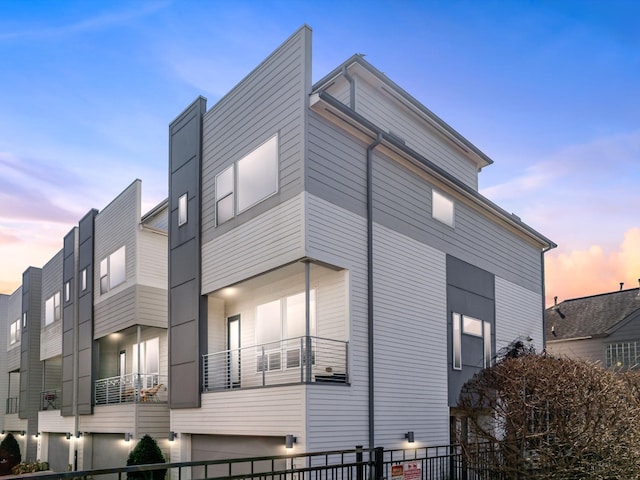 view of property exterior at dusk