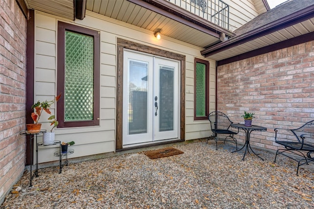 doorway to property featuring a patio area and french doors