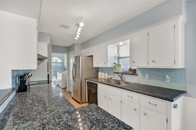 kitchen featuring visible vents, backsplash, black dishwasher, white cabinets, and a sink