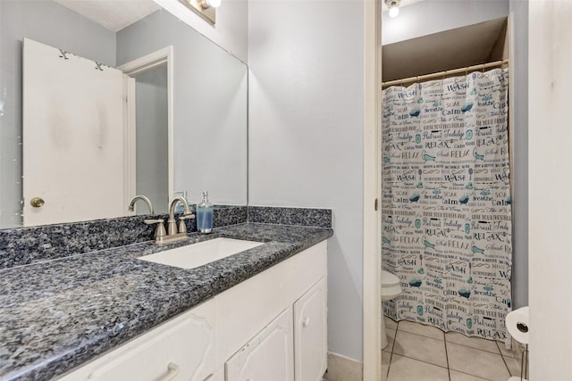 full bath featuring tile patterned flooring, a shower with shower curtain, toilet, and vanity