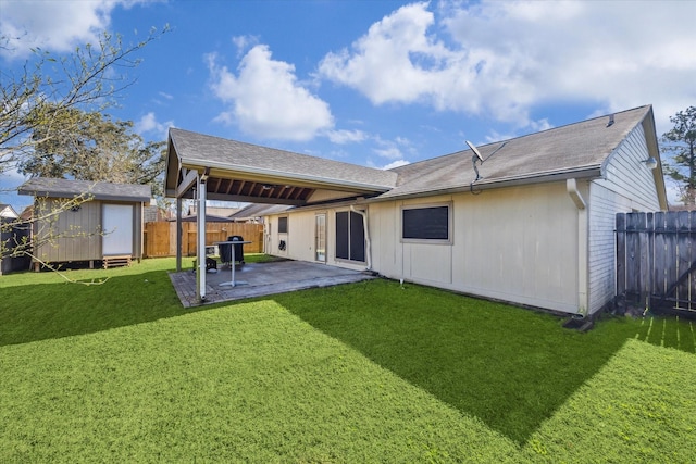 back of property with a patio, a fenced backyard, an outdoor structure, a yard, and a shed