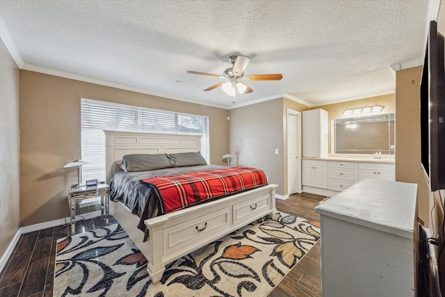 bedroom with ornamental molding, dark wood-style flooring, ensuite bath, and baseboards