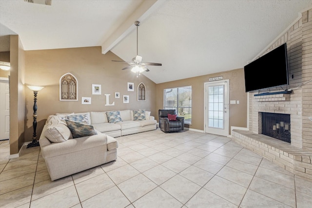 living room with light tile patterned floors, vaulted ceiling with beams, a ceiling fan, baseboards, and a brick fireplace