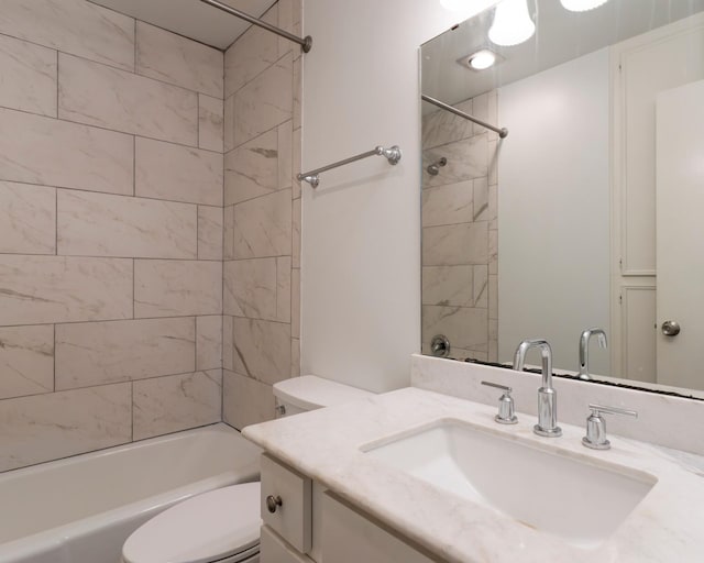 bathroom featuring shower / tub combination, vanity, and toilet