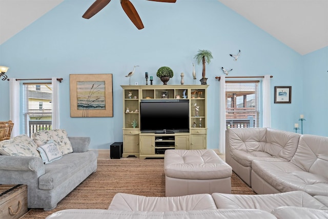 living room with high vaulted ceiling and a ceiling fan